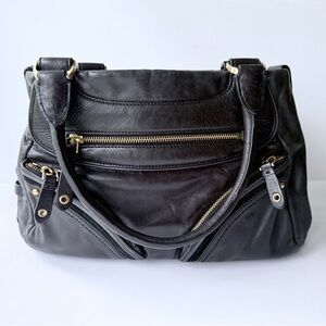 Cole Haan Black Leather Shoulder Bag w/ Exterior Zip Pockets & Suede Trim